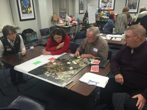 Attendees from the Pinelands workshop look at a local map and discuss problem spots or barriers, and identify places where green infrastructure opportunities could be explored. 