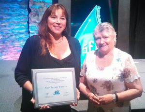 Maria DiSalvatore, left, vice chairwoman of the New Jersey Association for Floodplain Management, accepting New Jersey Future's award at the Association for Floodplain Management national conference in Grand Rapids, Michigan.